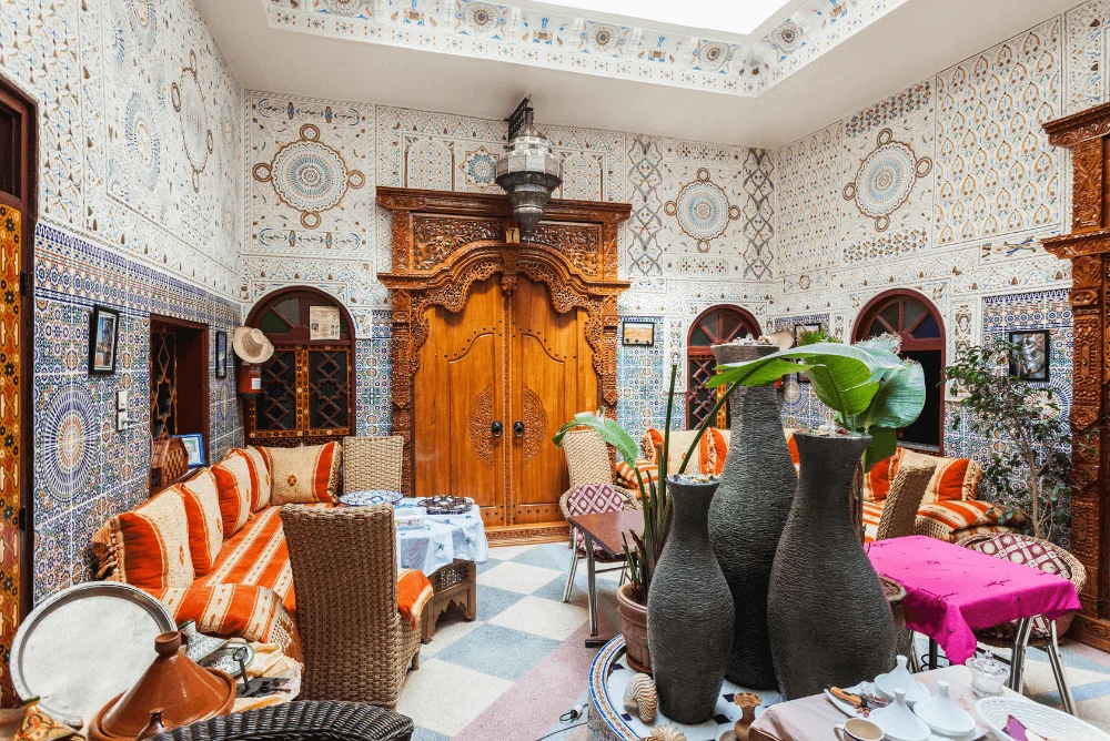 Traditional Moroccan riad in Fes with handcrafted tilework and courtyard seating